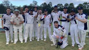 Gareth Morgan (in the centre) holding the match ball.