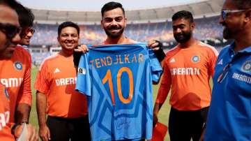 Virat Kohli with Sachin Tendulkar jersey.