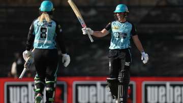 Grace Harris celebrates after scoring her fifty against Perth in the WBBL Challenger.