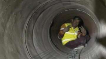 One of the workers shows victory sign while he was being rescued from the Silkyara tunnel in Uttarkashi.
