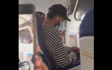 Indian batsman Virat Kohli travelling in economy class.