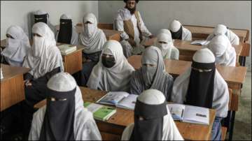 Afghan girls at a madrassa, which remained open since the Taliban takeover.
