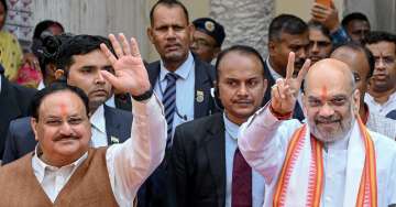 Union Home Minister Amit Shah and BJP National President JP Nadda leave after offering prayers at the Kalighat Kali Temple, in Kolkata.