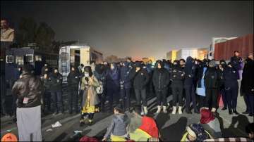 Islamabad police arresting Baloch protesters.