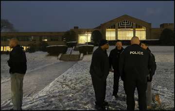 Albany police officers outside the Jewish temple following the shooting.