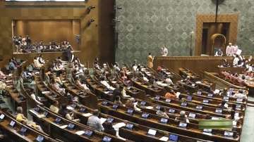 Opposition MPs protest in the Lok Sabha during the Winter session of Parliament, in New Delhi.