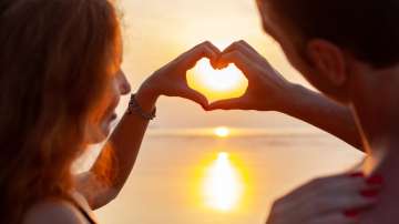 A couple making heart with their hands