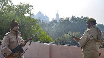 Security personnel stand guard near the Krishna Janambhoomi temple and Shahi Mosque Eidgah in Mathura.