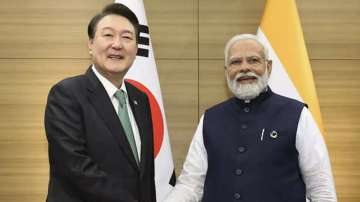 Korean President Yoon Suk Yeol (left) with Prime Minister Narendra Modi (right)