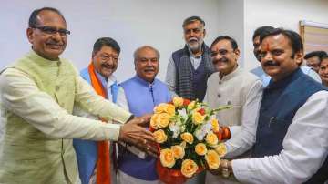 New Madhya Pradesh Assembly Speaker Narendra Singh Tomar being greeted by State Deputy Chief Minister Rajendra Shukla, former state chief minister Shivraj Singh Chouhan, BJP State President VD Sharma and others during the Winter session of MP Assembly, in Bhopal, Wednesday.