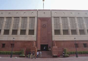 Security personnel and others at the Parliament House in New Delhi. 