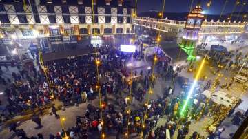 People gather at the clock tower Lal Chowk to attend a musical show to celebrate the new year 2024, in Srinagar.
