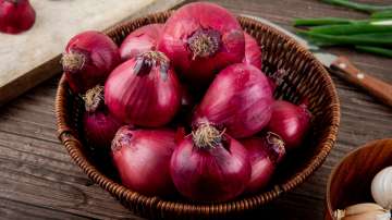 red onions on wooden background