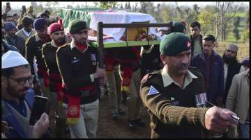 Villagers carry the casket of a soldier killed in Tuesday's suicide bombing.