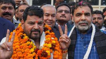 Brij Bhushan Sharan Singh (L) and Sanjay Singh (R).