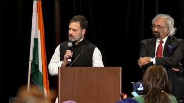 Indian Overseas Congress Chairman Sam Pitroda along with Rahul Gandhi during a public event.