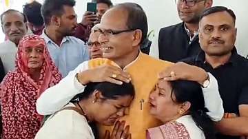 Former Madhya Pradesh chief minister Shivraj Singh Chouhan with Ladli Laxmi Yojana beneficiaries, in Bhopal