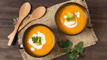 Two bowls of creamy soup