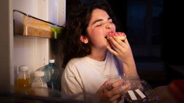 Gurl eating donut from fridge