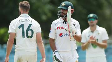 Shan Masood celebrates his century against Prime Minister's XI.