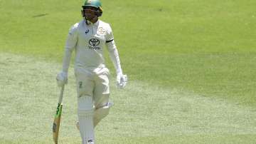Usman Khawaja wears a black armband for a humanitarian cause in the Perth Test.
