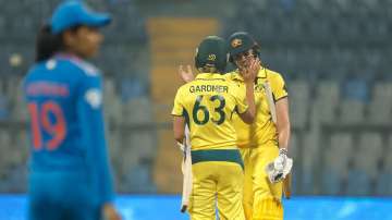 Tahlia McGrath and Ashleigh Gardner celebrate after beating India in the first ODI.
