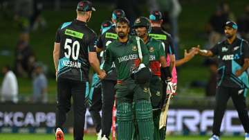 New Zealand and Bangladesh players shake hands after the 1st T20I in Napier.