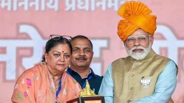 Prime Minister Narendra Modi with former Rajasthan chief minister Vasundhara Raje during a public meeting. (File photo)