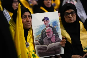 Supporters holding portrait of slain Qassem Soleimani 