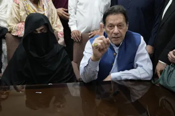 Former Pakistan Prime Minister Imran Khan with his third wife, Bushra Bibi during a hearing.