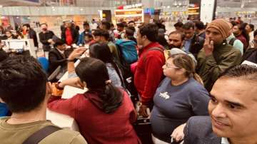 Passengers stuck at Delhi Airport.