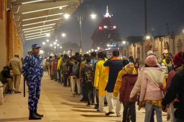 Devotees wait in a queue to enter the Ram temple, in Ayodhya.
