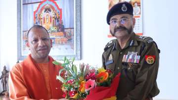 Uttar Pradesh Chief Minister Yogi Adityanath with new acting DGP Prashant Kumar