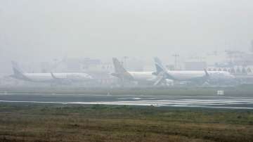 10 flights diverted, nearly 100  delayed amid dense fog