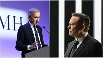 Bernard Arnault, Chairman and CEO of LVMH Moet Hennessy Louis Vuitton (L) and Tesla CEO Elon Musk