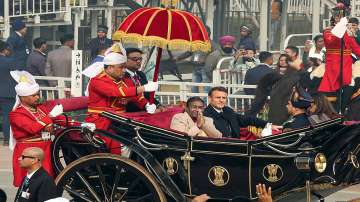 President Droupadi Murmu and the chief guest French President Emmanuel Macron arrive in a special presidential carriage to attend the 75th Republic Day ceremony, at the Kartavya Path, in New Delhi.