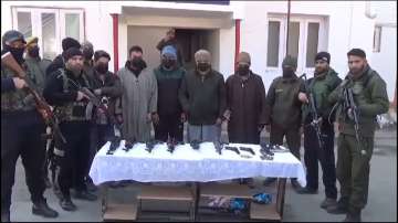 Jammu and Kashmir Police with the arrested terrorists.