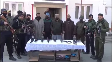 Jammu and Kashmir Police with the arrested terrorists.