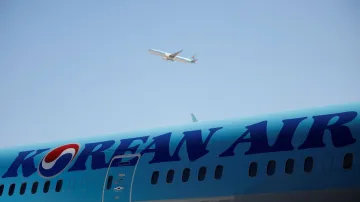 Korean Air flight parked at an airport.