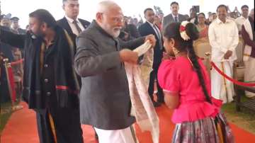 Prime Minister Modi gifts his shawl to the singer as a special gesture