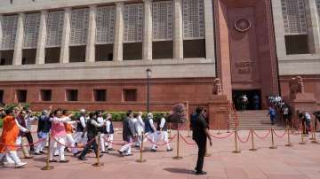 Prime Minister Narendra Modi with Union Ministers Amit Shah and Rajnath Singh and other parliamentarians enters the new Parliament building, in New Delhi.