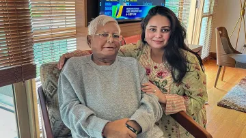 Rashtriya Janata Dal (RJD) President Lalu Prasad Yadav with his daughter Rohini Acharya.