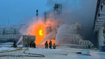 Firefighters work to extinguish fire at the Novatek terminal in the port of Ust-Luga