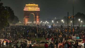 People visit the India Gate on the first day of the new year 2024 in New Delhi.