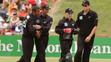 Andre Adams celebrates with teammates Chris Harris, Brendon McCullum and Kyle Mills.