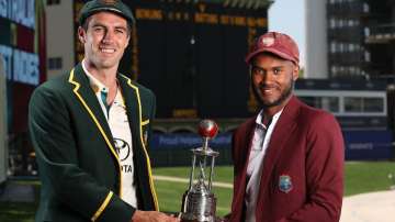 Pat Cummins and Kraigg Brathwaite pose for the cameras with the Frank Worrell Trophy.