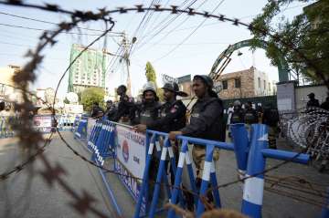Pakistan Police put barricades ahead of massive rally in Islamabad