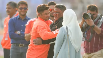 Sarfaraz Khan with his father and wife after the cap presentation in his Test debut against England