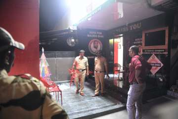 Police personnel at the site where Shiv Sena (UBT) leader Vinod Ghosalkars son Abhishek was shot, in Mumbai