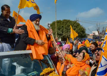 Shiromani Akali Dal (SAD) President Sukhbir Singh Badal greets people during ‘Punjab Bachao Yatra’ at Attari, in Amritsar district. (File photo)